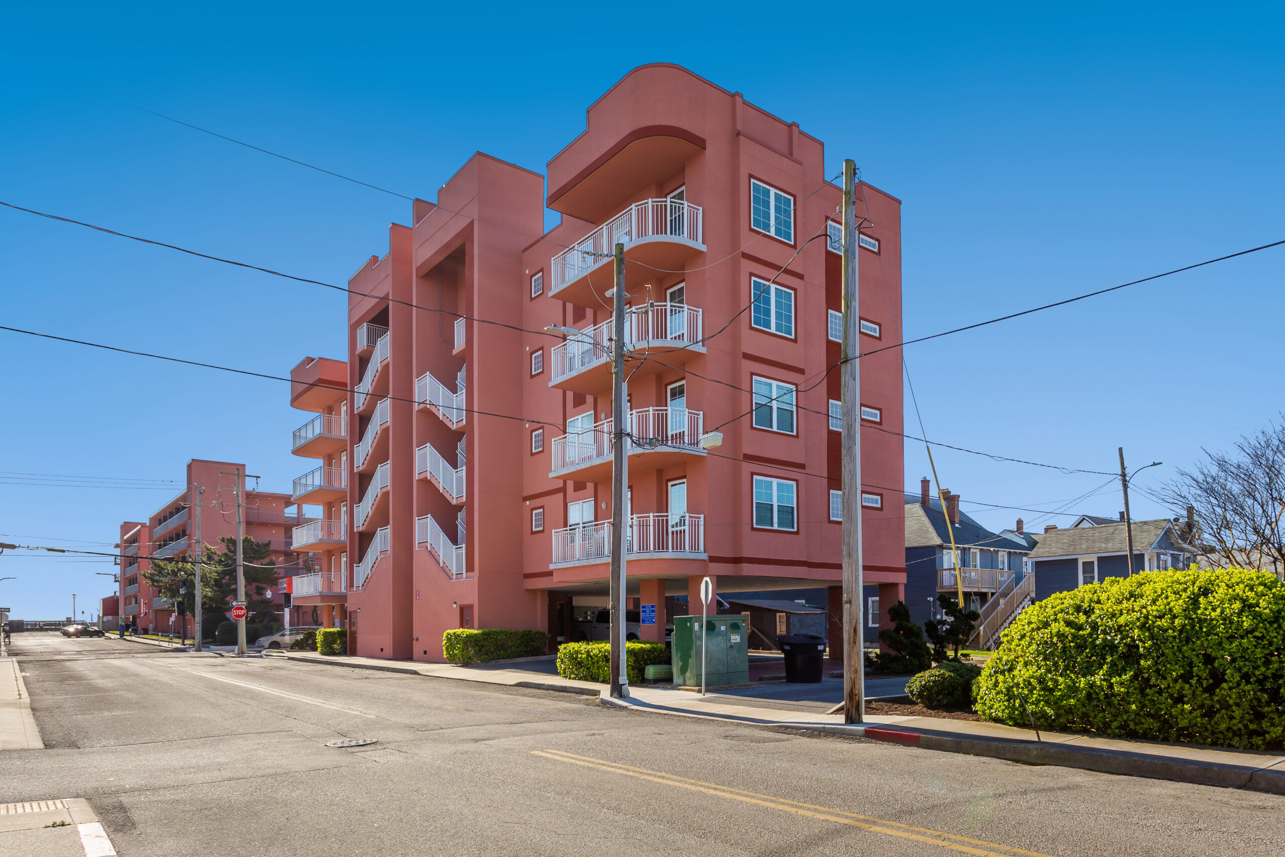 an apartment building on the corner of a street